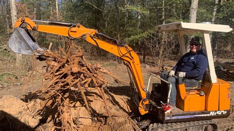 mini excavator removing stumps|pulling stumps with excavator.